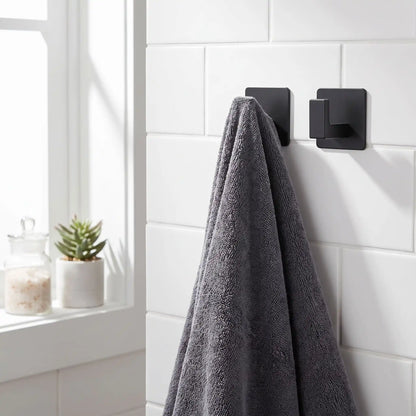 Crochets muraux adhésifs en aluminium noir mat, solution stable pour un rangement mural durable