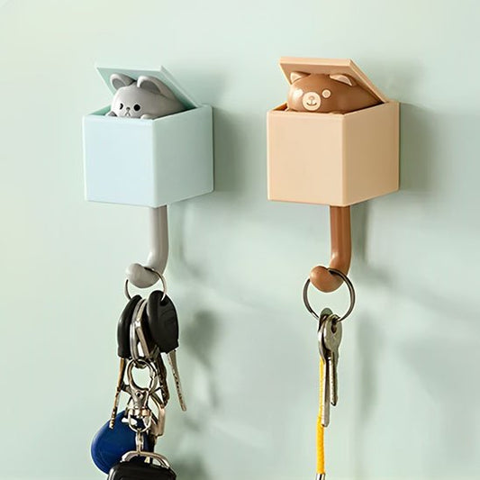 Crochets muraux animaux interactifs avec clés suspendues montrant le mécanisme de sortie du chat et de l'ours