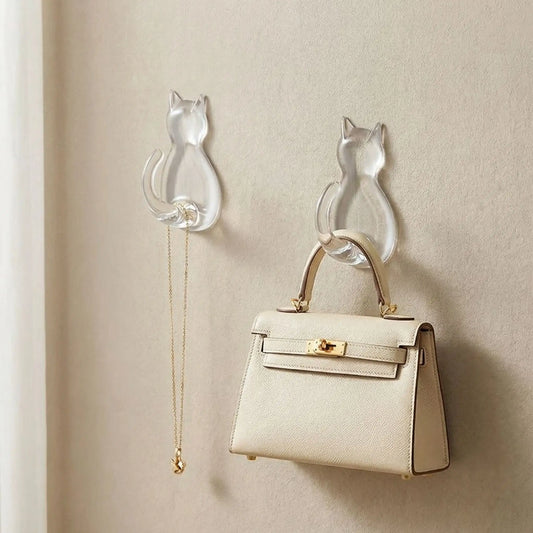 Lot de 2 crochets muraux chat en acrylique transparent supportant un sac à main et un collier, design chic et élégant.