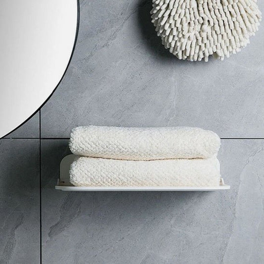 Petite étagère murale avec serviettes