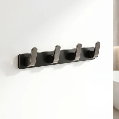 Porte-manteau mural Alumure à 4 crochets en aluminium brossé noir mat, vue de profil épurée.