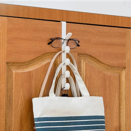 Porte-manteau de porte Modèle Futé blanc utilisé pour suspendre un sac à main et des lunettes, idéal pour l'organisation d'une entrée.